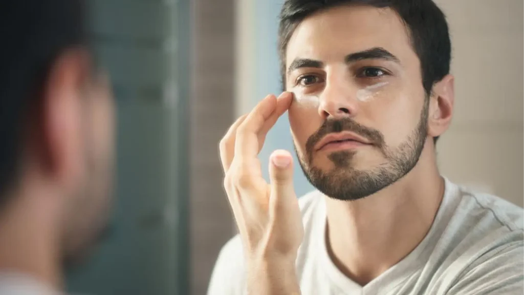 Man applying anti-aging skincare products