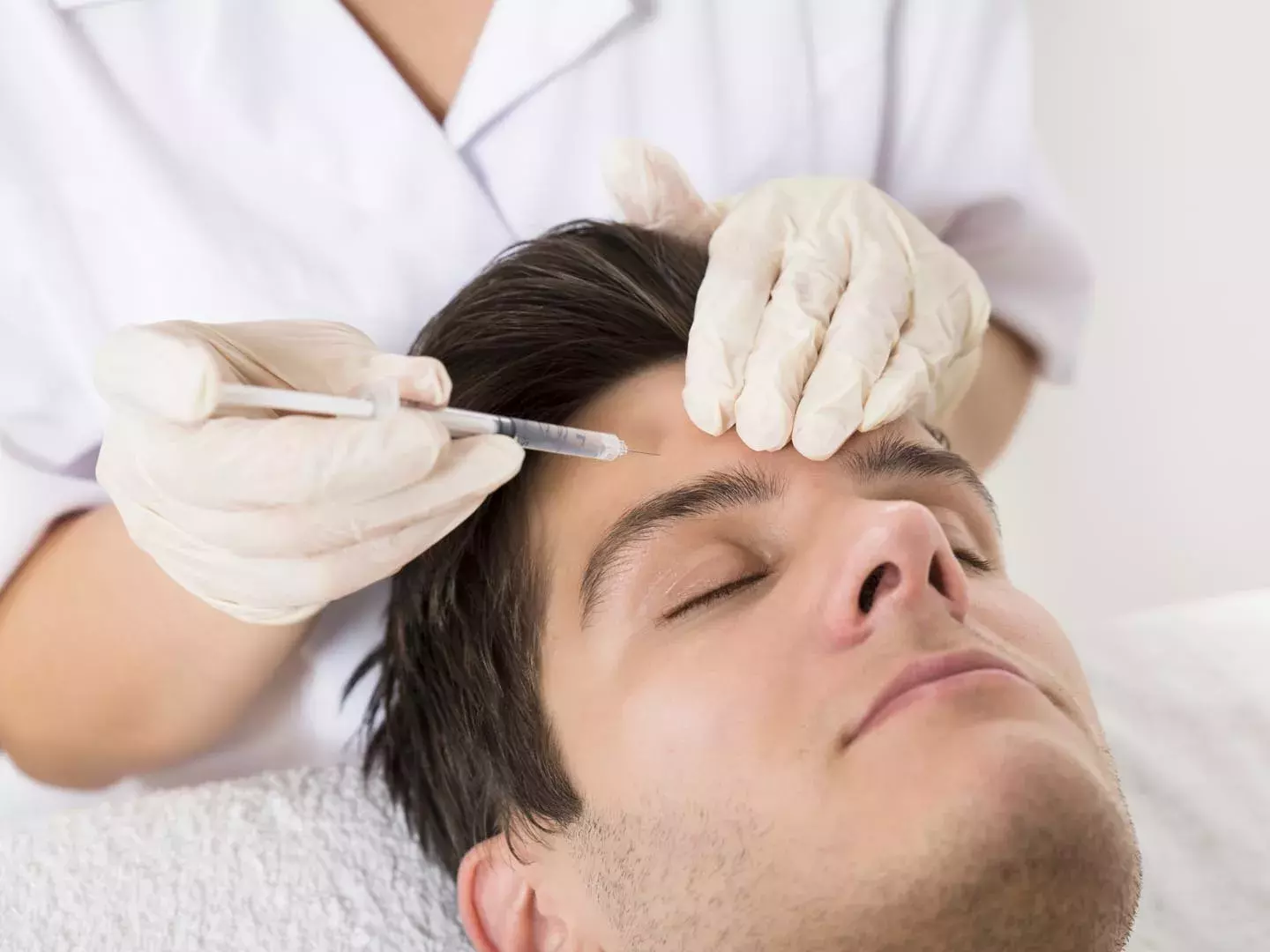 Botox safety information for men - qualified professional administering treatment